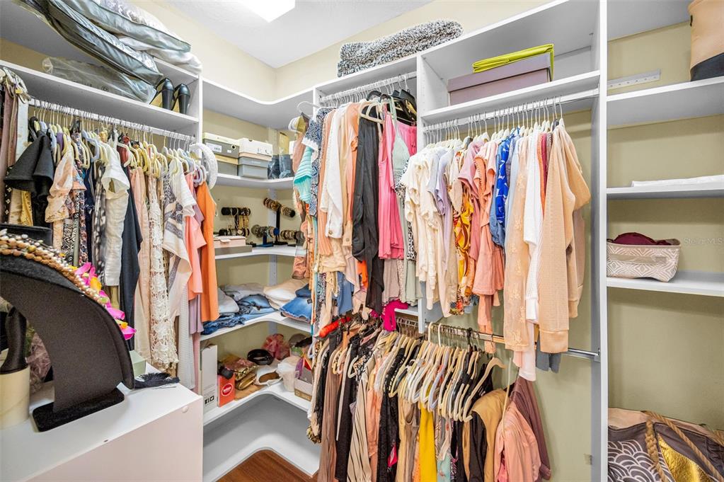 47 West Morgan Street Tarpon Springs, FL 34689 - Photo 48 of 64 a view of walk in closet with clothes and shoes