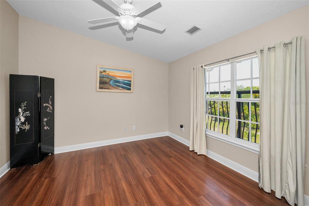 47 West Morgan Street Tarpon Springs, FL 34689 - Photo 49 of 64 wooden floor in an empty room with a window