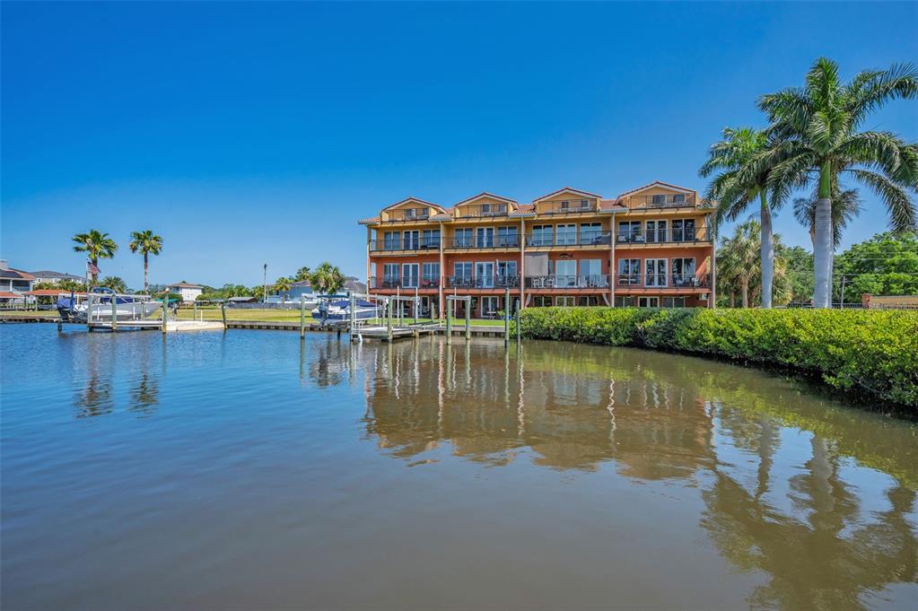 47 West Morgan Street Tarpon Springs, FL 34689 - Photo 61 of 64 a view of residential house with outdoor space and lake view