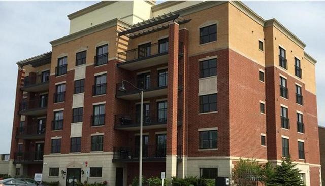 10765 Clock Tower Drive, Unit 602 Countryside, IL 60525 - Photo 1 of 21 a front view of a building