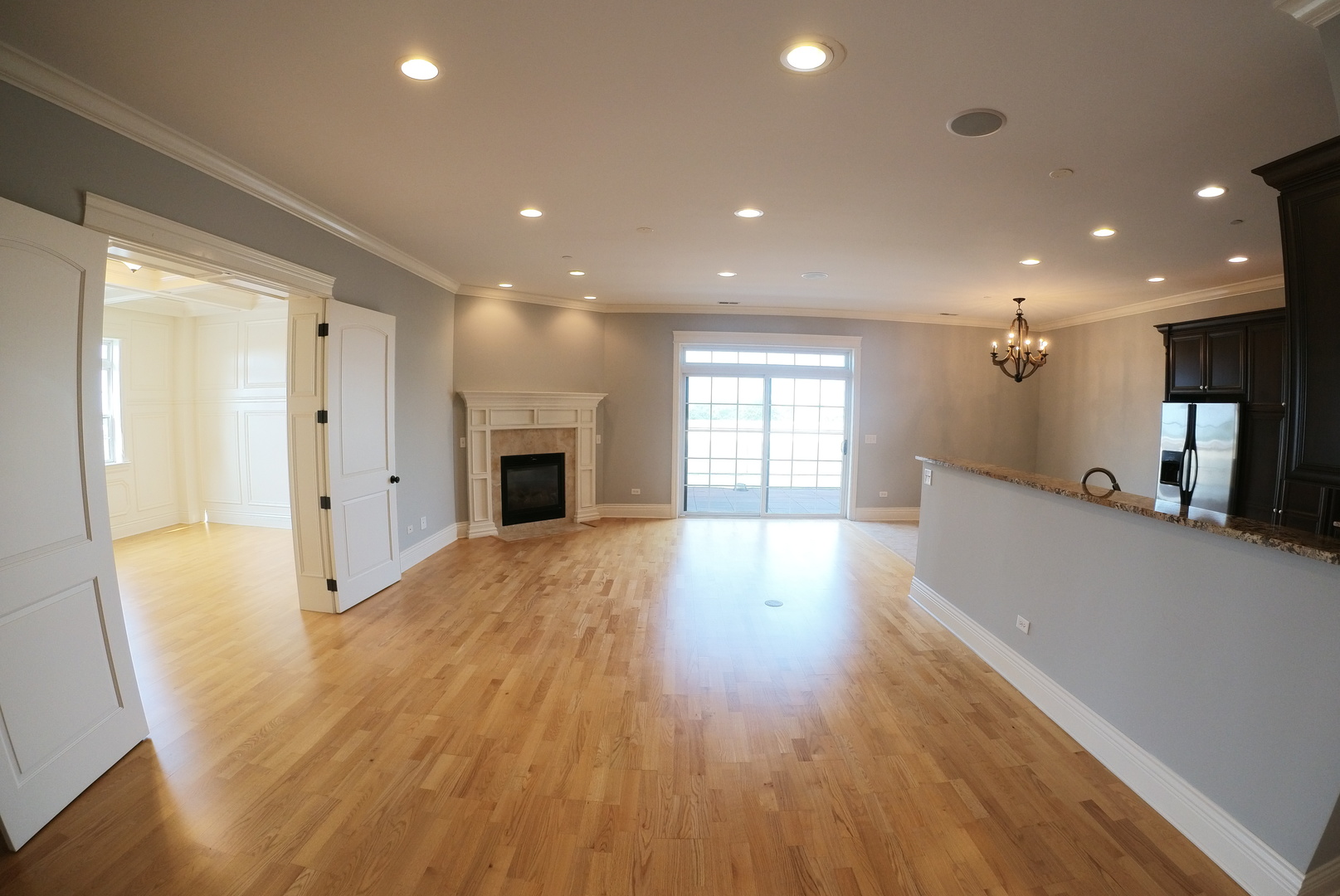 10765 Clock Tower Drive, Unit 602 Countryside, IL 60525 - Photo 3 of 21 a view of a big room with wooden floor and windows
