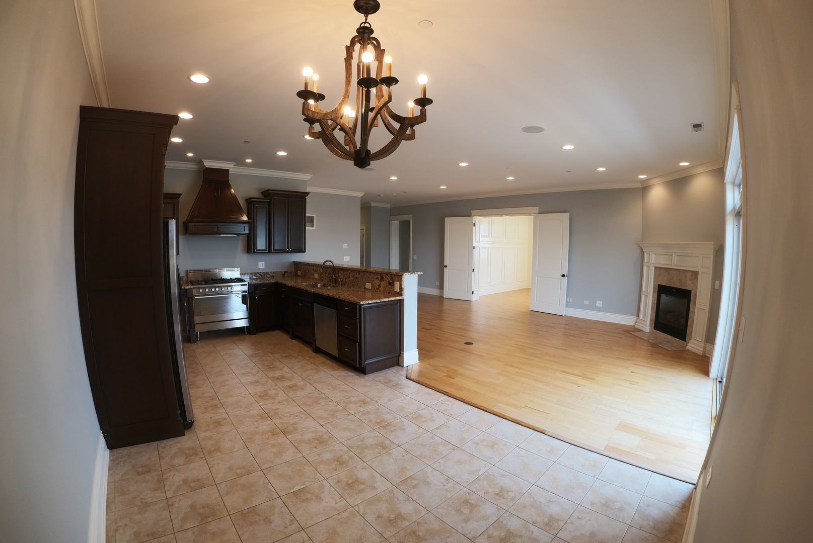 10765 Clock Tower Drive, Unit 602 Countryside, IL 60525 - Photo 5 of 21 a large kitchen with a large counter top appliances and cabinets