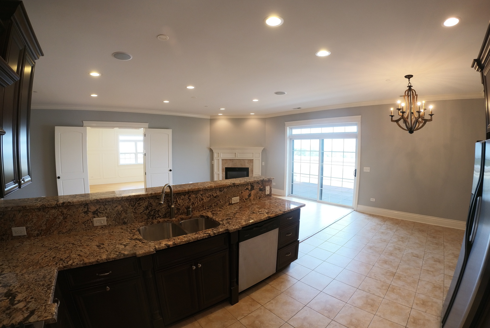 10765 Clock Tower Drive, Unit 602 Countryside, IL 60525 - Photo 7 of 21 a large kitchen with granite countertop a large counter top and sink