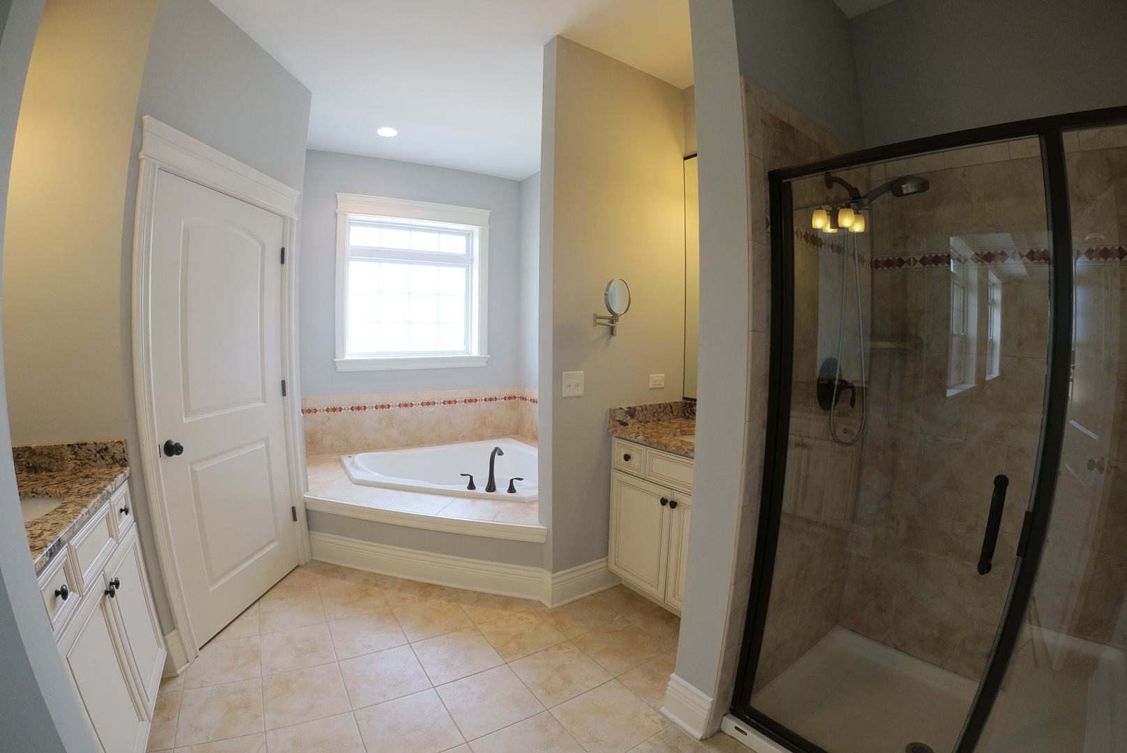 10765 Clock Tower Drive, Unit 602 Countryside, IL 60525 - Photo 9 of 21 a bathroom with a tub shower and mirror