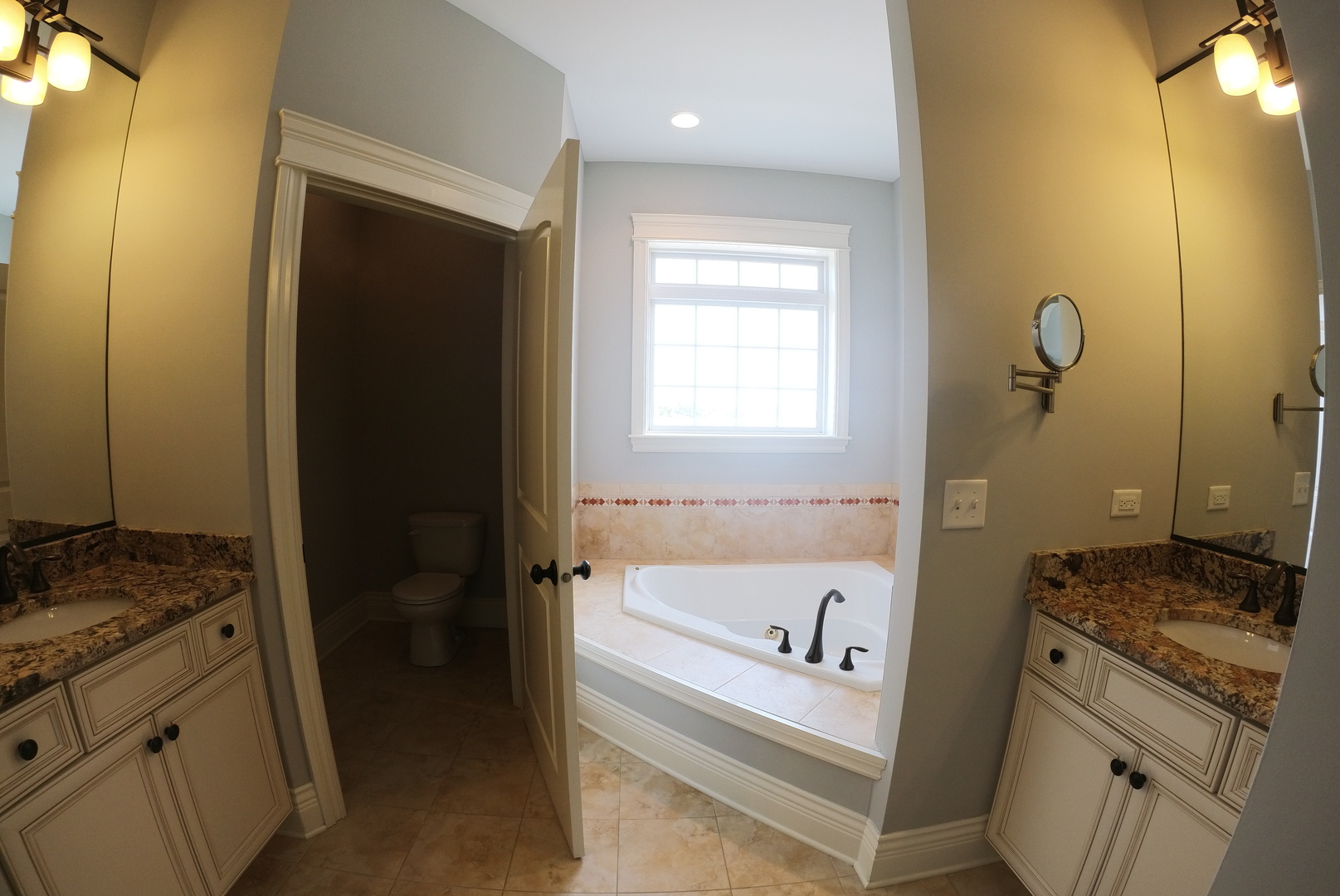 10765 Clock Tower Drive, Unit 602 Countryside, IL 60525 - Photo 10 of 21 a bathroom with a granite countertop sink and a bathtub
