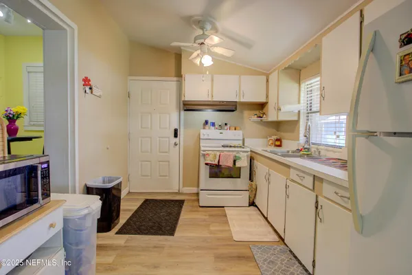 a bedroom with bed and a flat screen tv