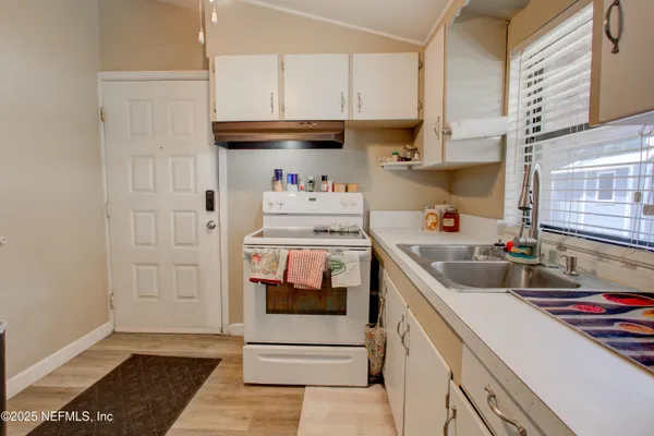 a view of a lake with a yard