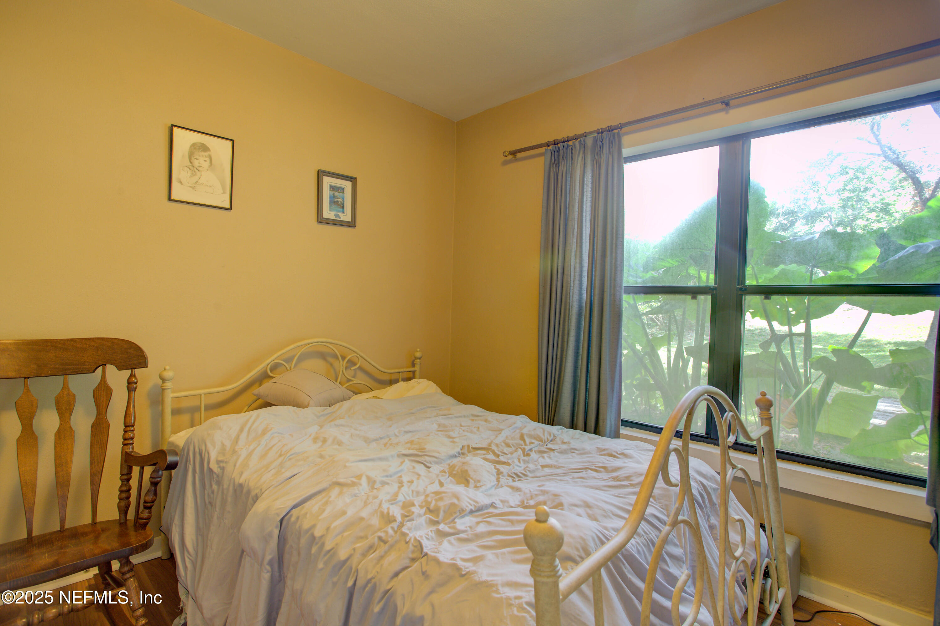 7861 State Road 21 Keystone Heights, FL 32656 - Photo 22 of 51 a bedroom with a bed and glass door