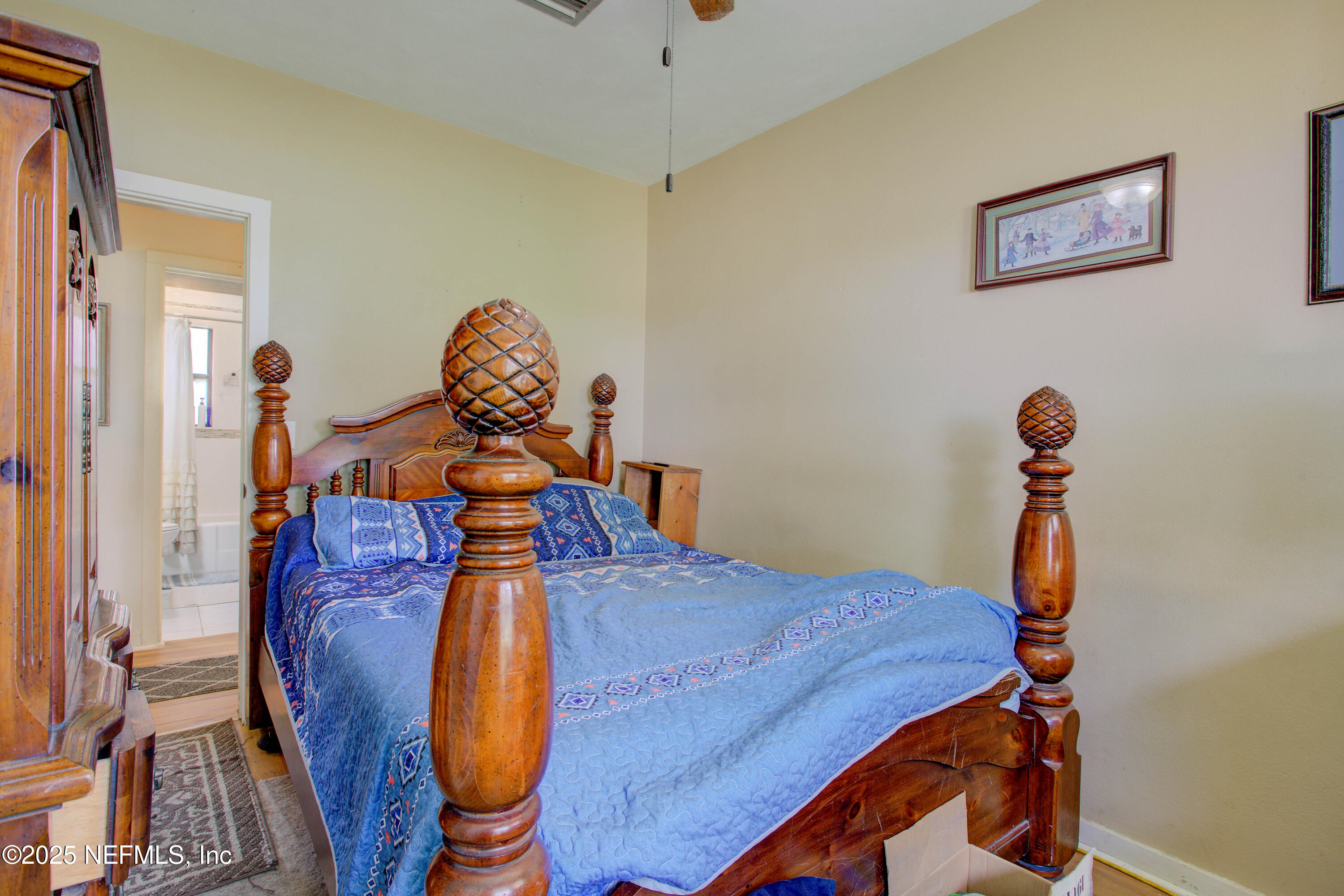 7861 State Road 21 Keystone Heights, FL 32656 - Photo 23 of 51 a bedroom with a bed and a chandelier
