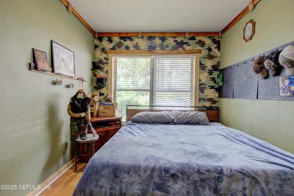 a view of a backyard with large trees