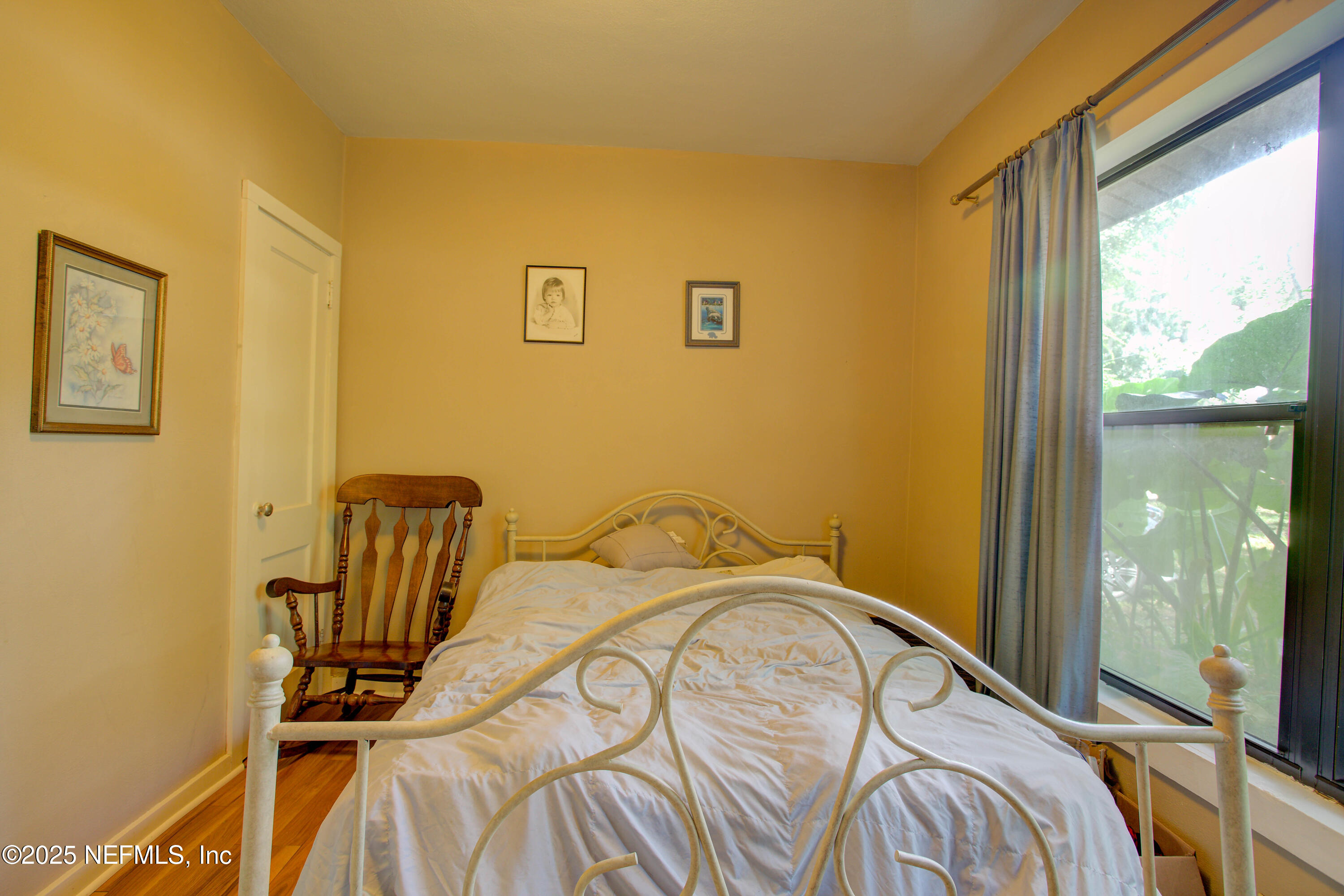 7861 State Road 21 Keystone Heights, FL 32656 - Photo 27 of 51 a bedroom with a bed and wooden floor