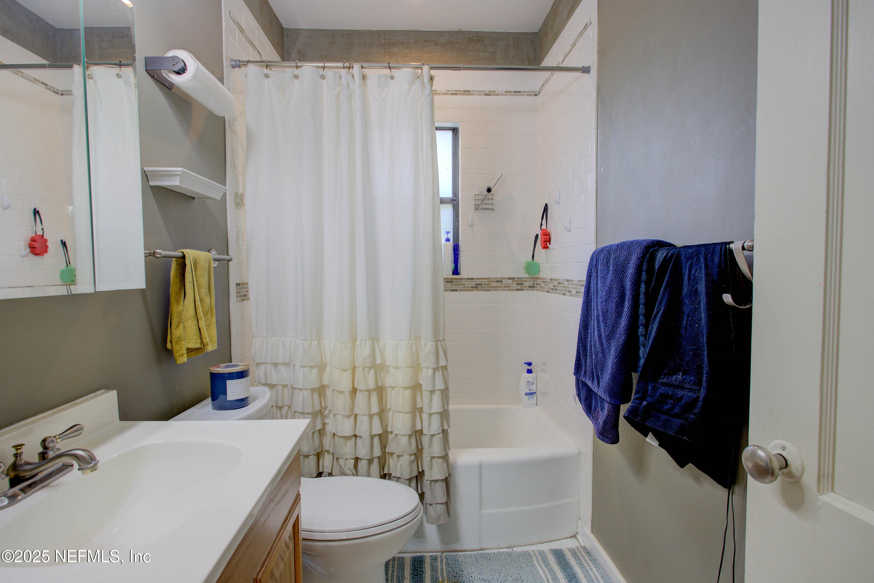 7861 State Road 21 Keystone Heights, FL 32656 - Photo 35 of 51 a bathroom with a sink toilet and shower