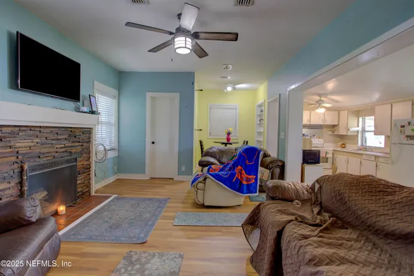 a kitchen with a sink a stove and cabinets
