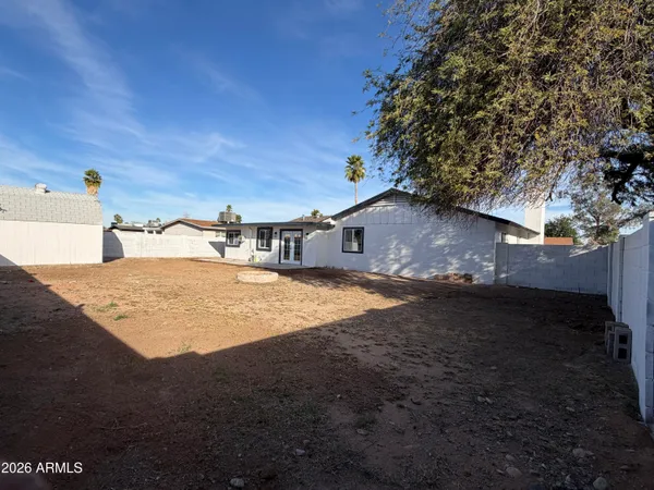 a front view of a house with a big yard