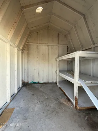 a kitchen with granite countertop a sink stove and refrigerator