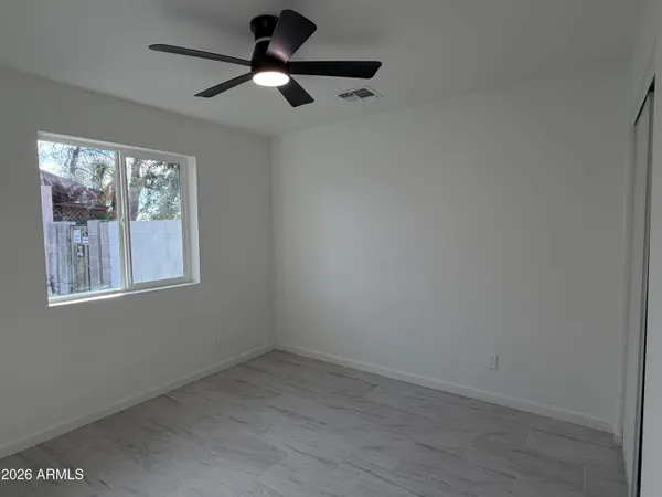 a view of an empty room with a window