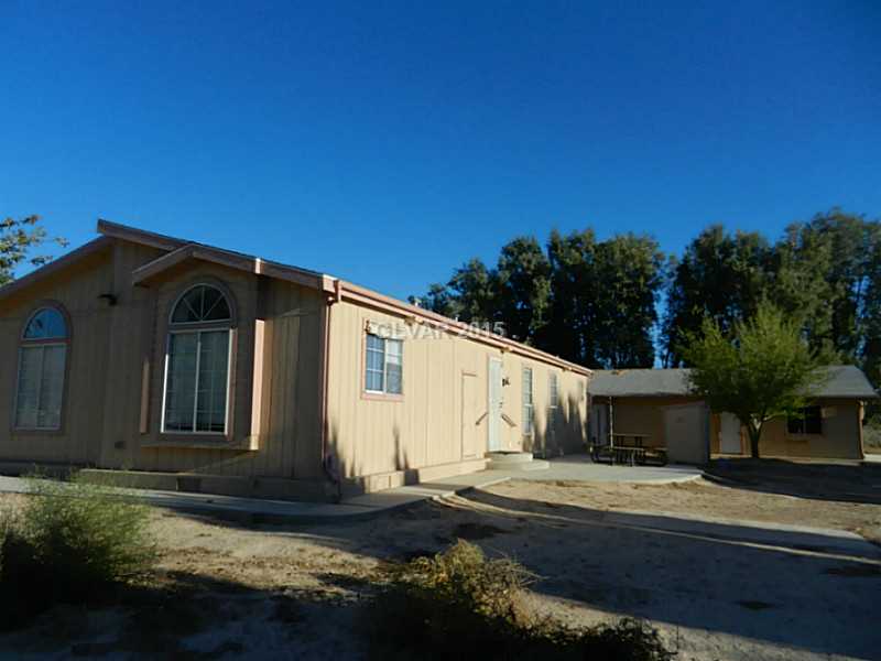 Property Photo. Back side of home and garage