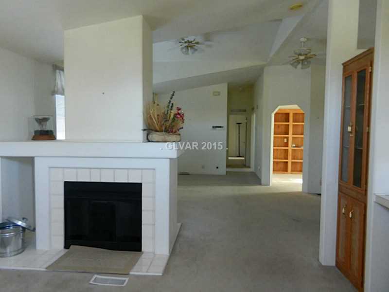Property Photo. Family rm view of Office and Hall to Bdrms