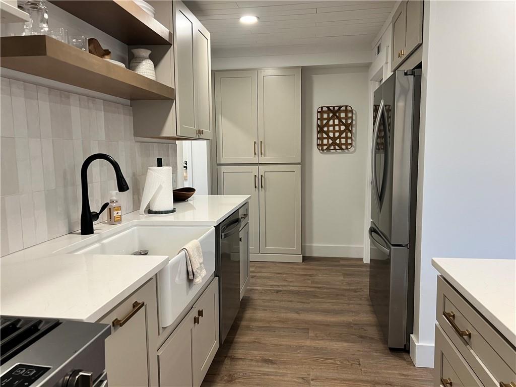 1006 Edgewood Road New Kensington, PA 15068 - Photo 11 of 47 a kitchen with a sink cabinets and stainless steel appliances
