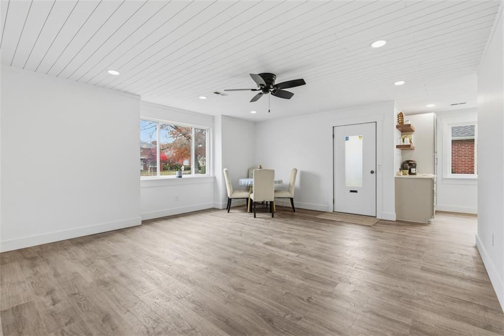 1006 Edgewood Road New Kensington, PA 15068 - Photo 18 of 47 a view of an empty room with a window and wooden floor