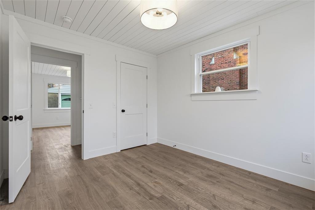 1006 Edgewood Road New Kensington, PA 15068 - Photo 22 of 47 an empty room that has a window and wooden floor