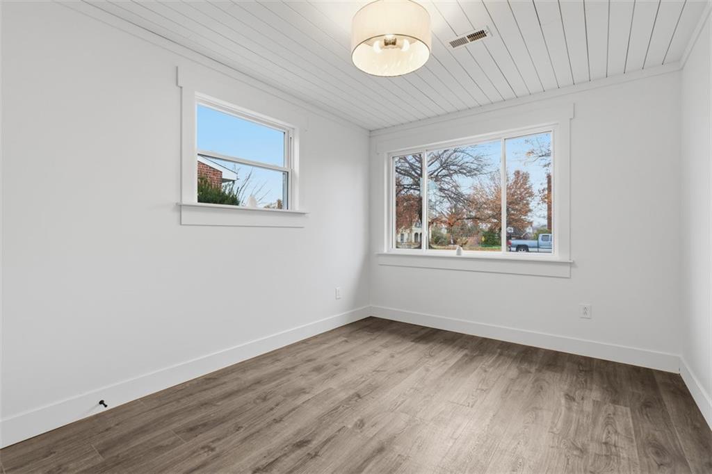 1006 Edgewood Road New Kensington, PA 15068 - Photo 23 of 47 an empty room with wooden floor and windows