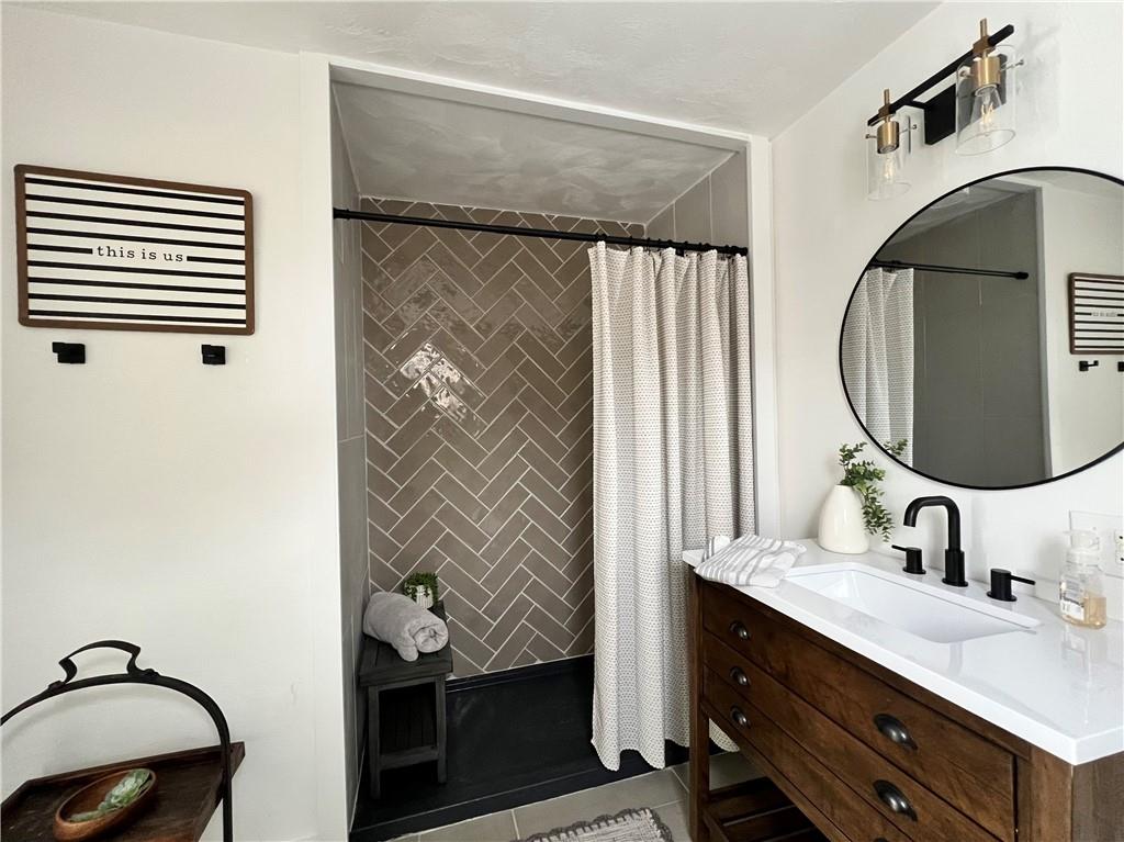 1006 Edgewood Road New Kensington, PA 15068 - Photo 30 of 47 a bathroom with a sink and a mirror