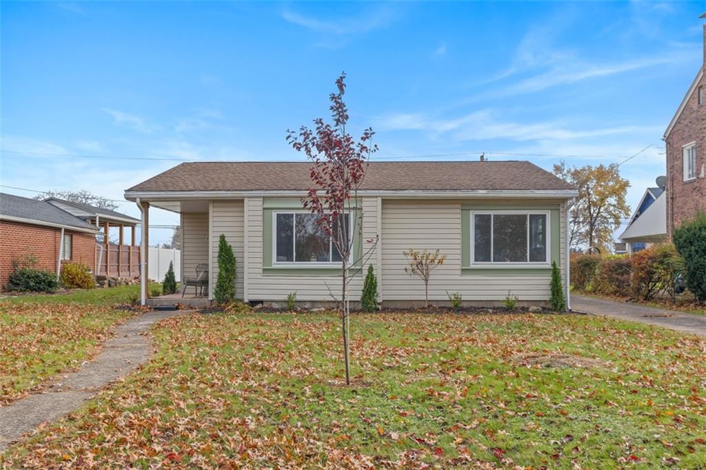 1006 Edgewood Road New Kensington, PA 15068 - Photo 32 of 47 a front view of a house with a garden