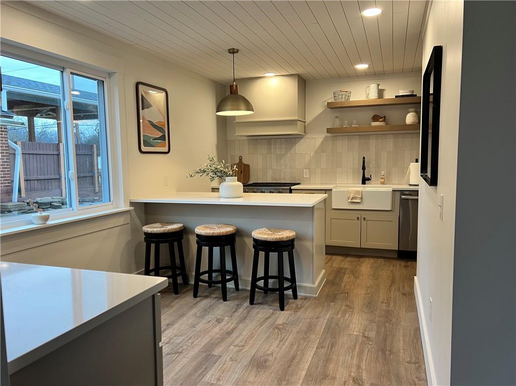 1006 Edgewood Road New Kensington, PA 15068 - Photo 5 of 47 a kitchen with a sink cabinets and wooden floor