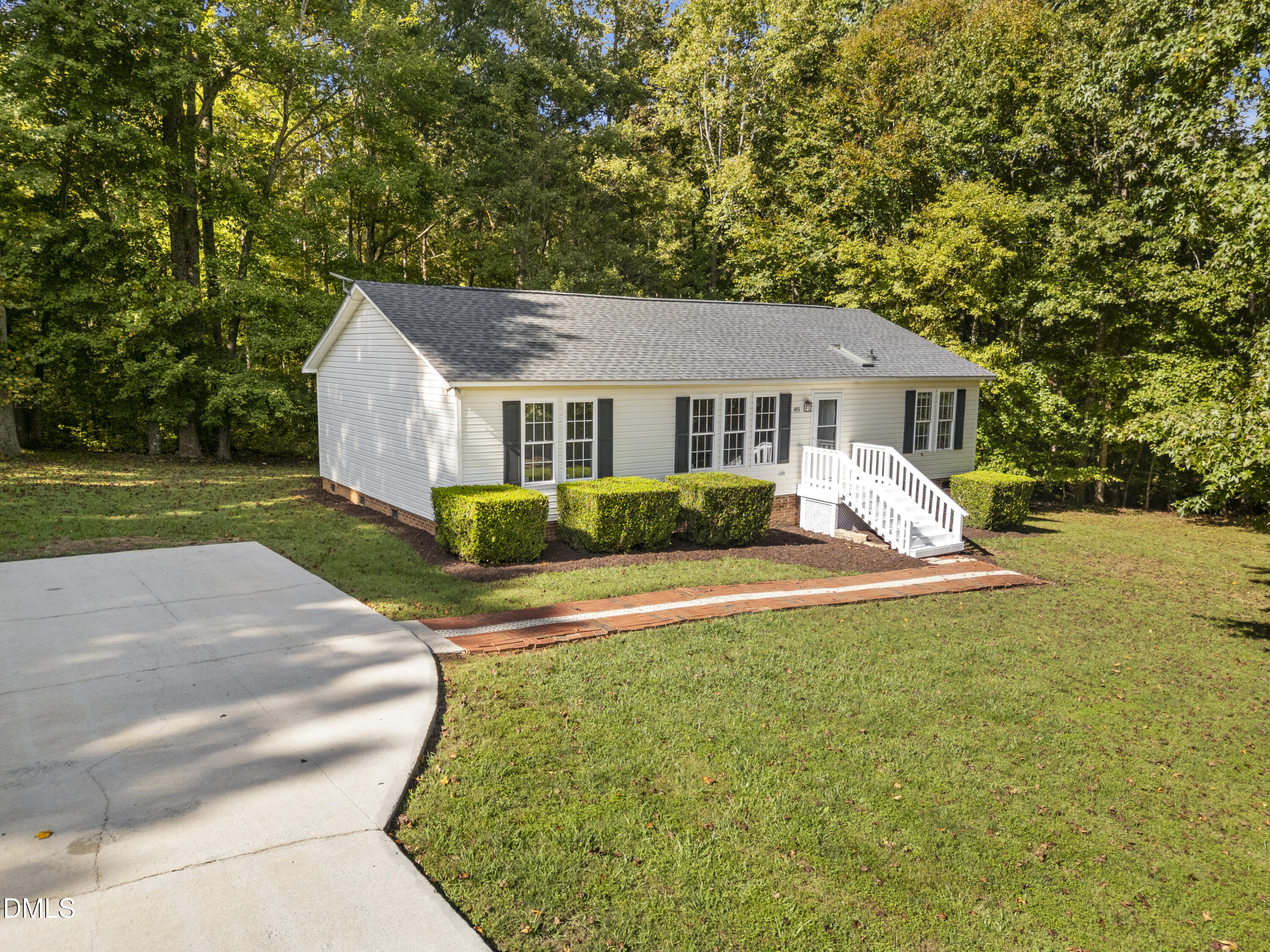4551 Sugar Maple Road Oxford, NC 27565 - Photo 1 of 23 a view of a house with a yard and plants