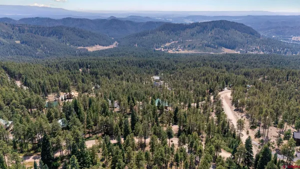 a view of an outdoor sitting area with a mountain view