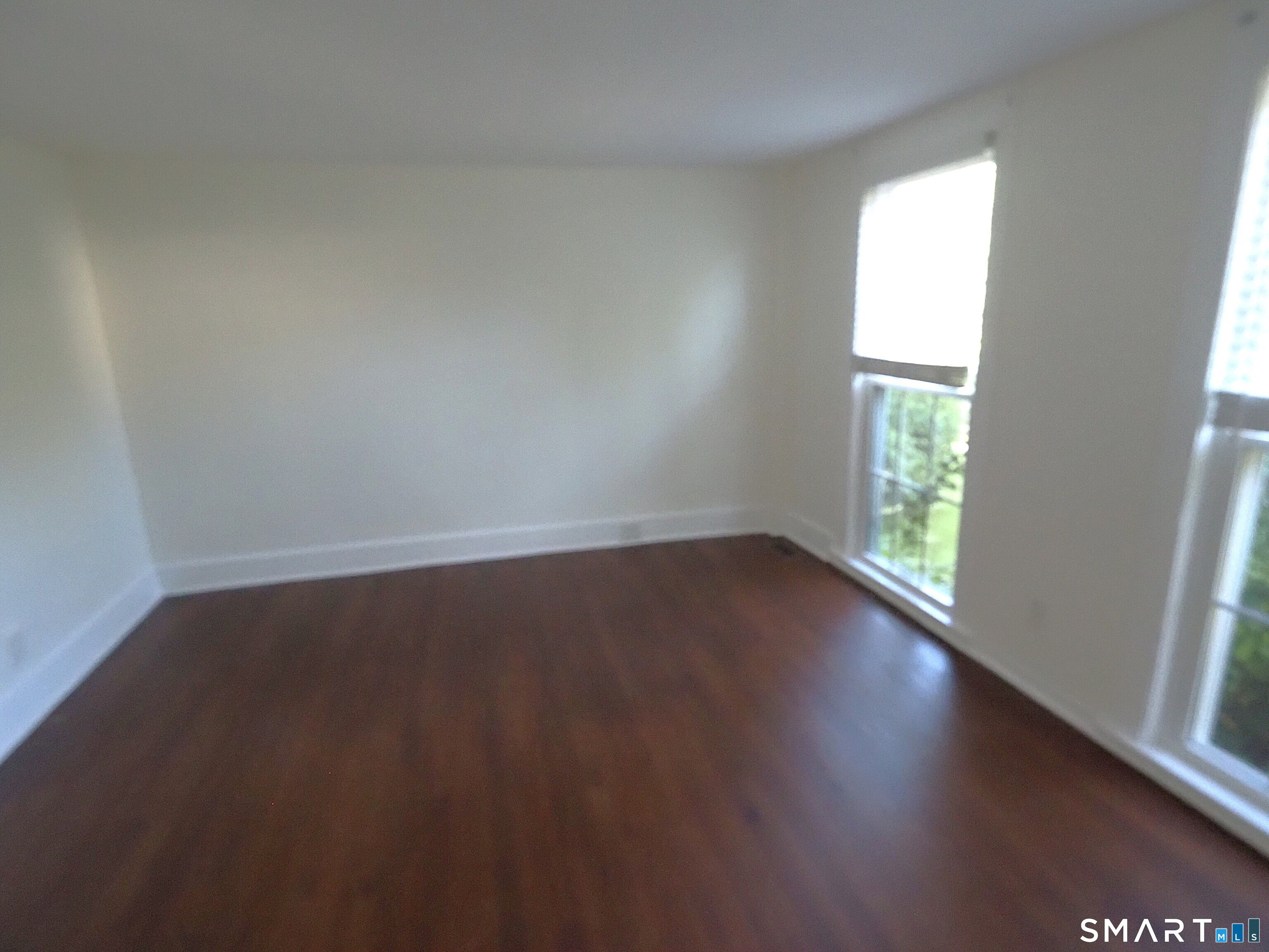 25-27 Hebron Road Andover, CT 06232 - Photo 10 of 15 Wood floors and floor to ceiling windows allowing light to come in!