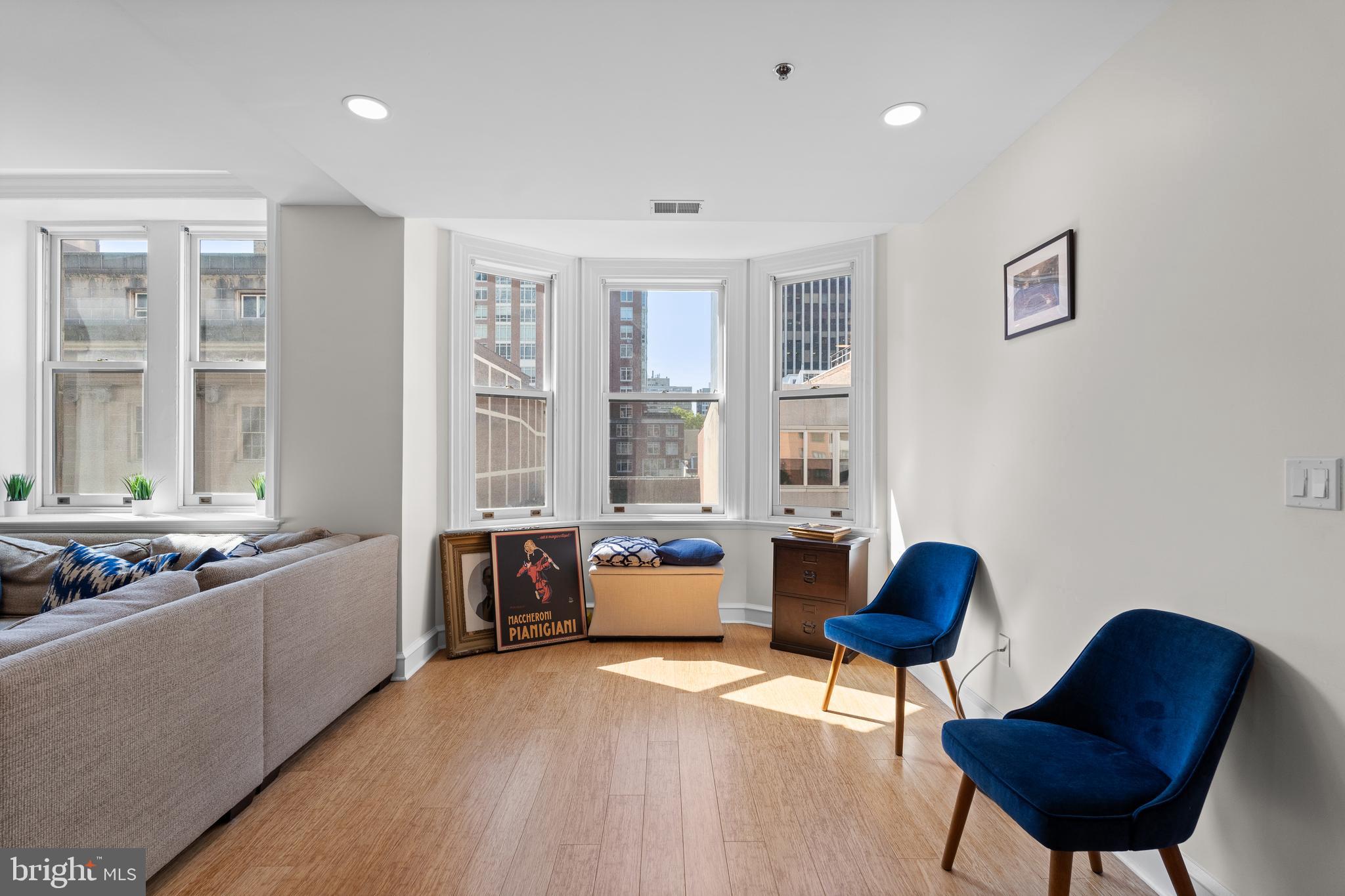 1811 Chestnut Street, Unit 501 Philadelphia, PA 19103 - Photo 11 of 26 a living room with furniture and a large window