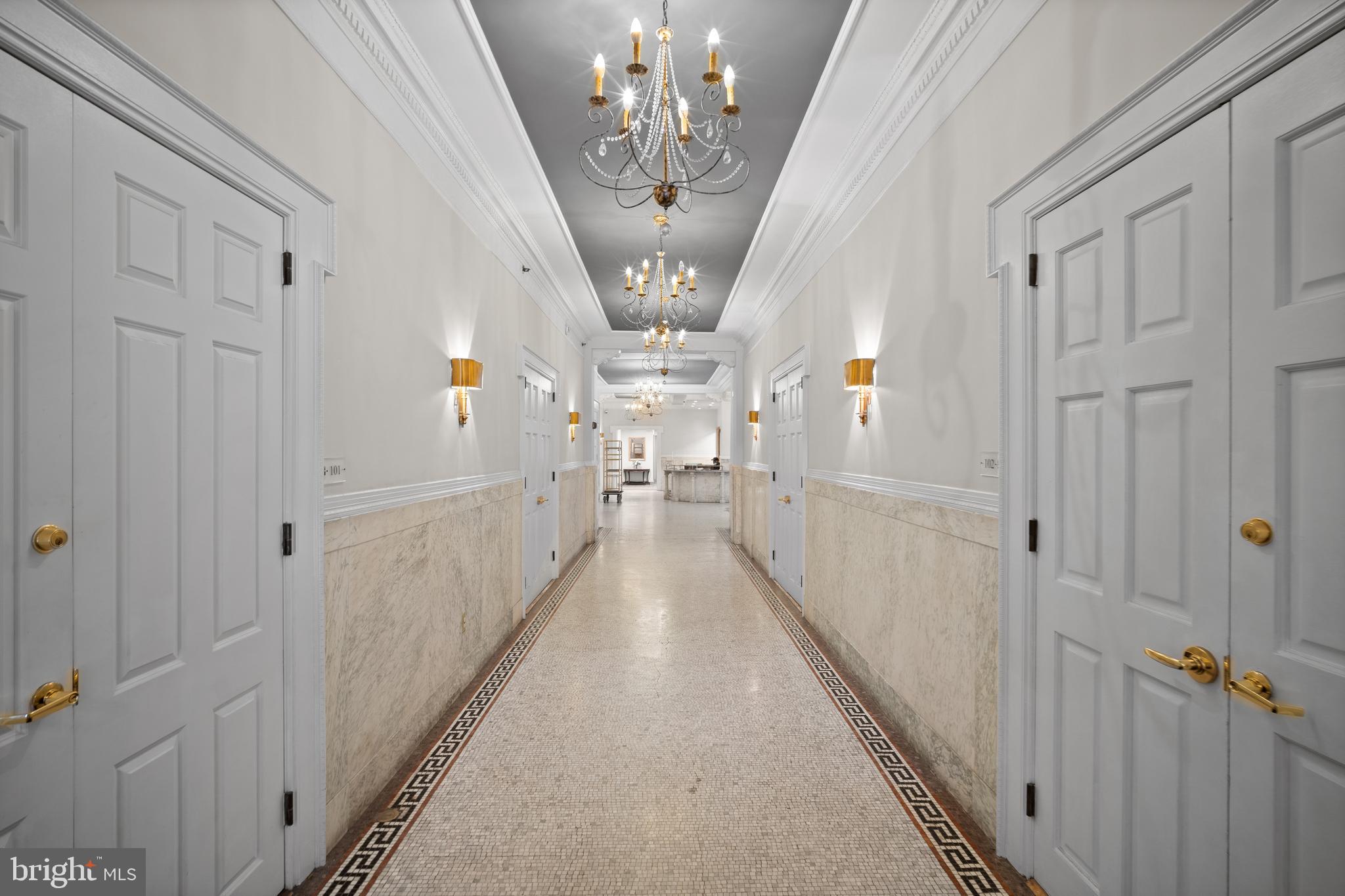 1811 Chestnut Street, Unit 501 Philadelphia, PA 19103 - Photo 26 of 26 a view of a hallway with chandelier
