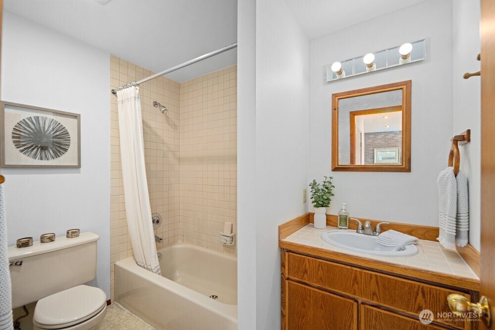 902 7th Avenue South Edmonds, WA 98020 - Photo 27 of 31 a bathroom with a sink toilet and shower