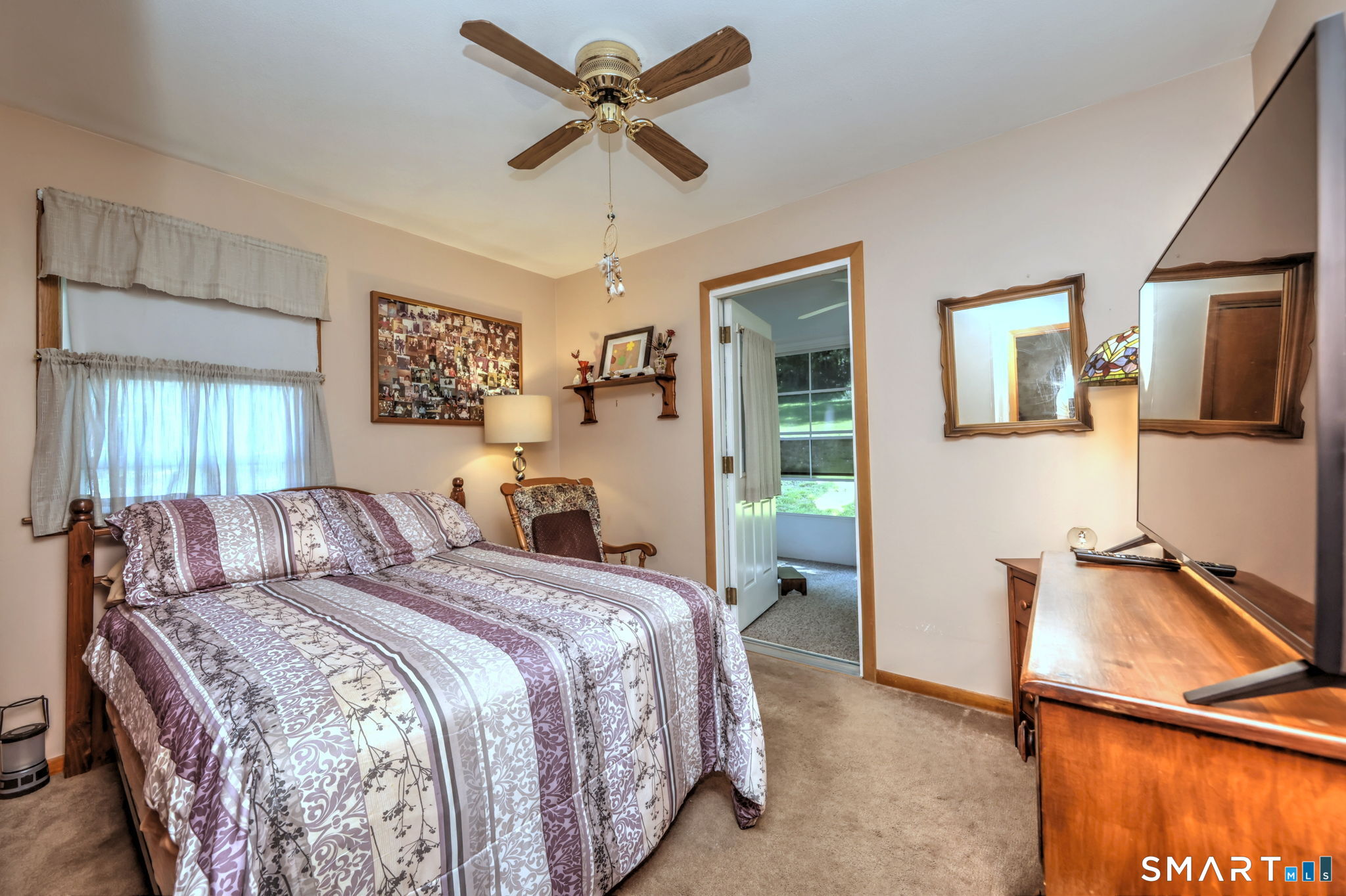 212 Swain Avenue Meriden, CT 06450 - Photo 26 of 38 a bedroom with a large bed and a chandelier