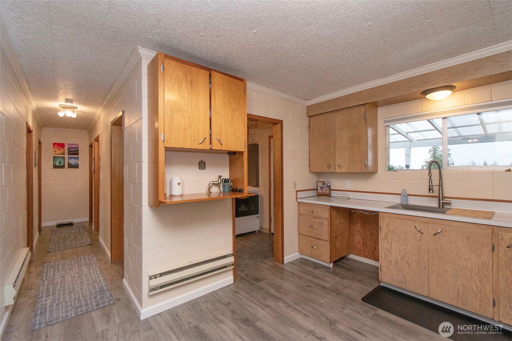 163 Cliff Robinson Lane Sequim, WA 98382 - Photo 14 of 40 a kitchen with stainless steel appliances a refrigerator sink and cabinets