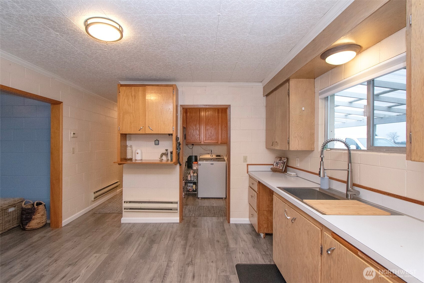163 Cliff Robinson Lane Sequim, WA 98382 - Photo 15 of 40 a kitchen with a sink cabinets stainless steel appliances and a window