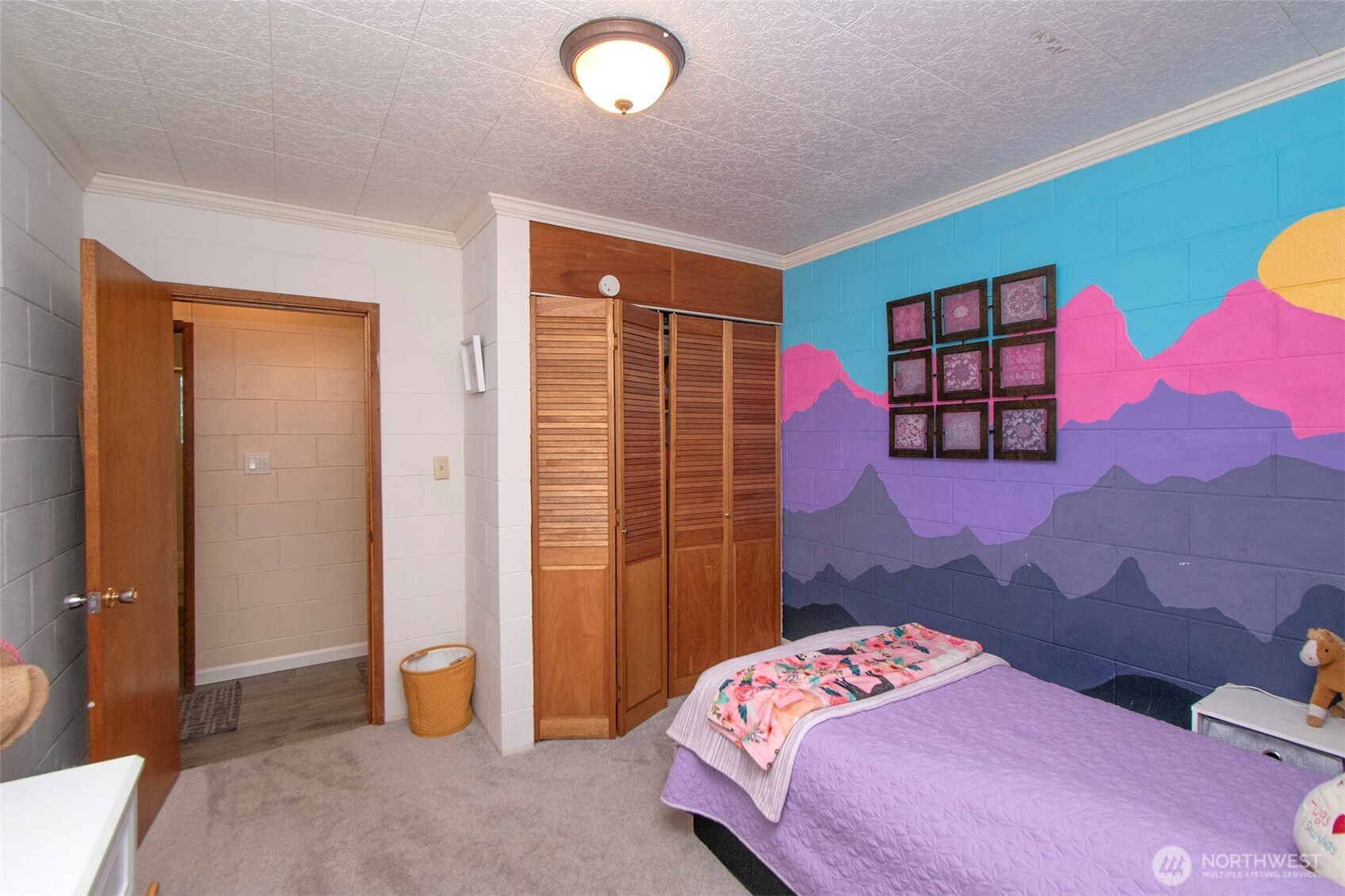 163 Cliff Robinson Lane Sequim, WA 98382 - Photo 19 of 40 a bedroom with a bed and a dresser