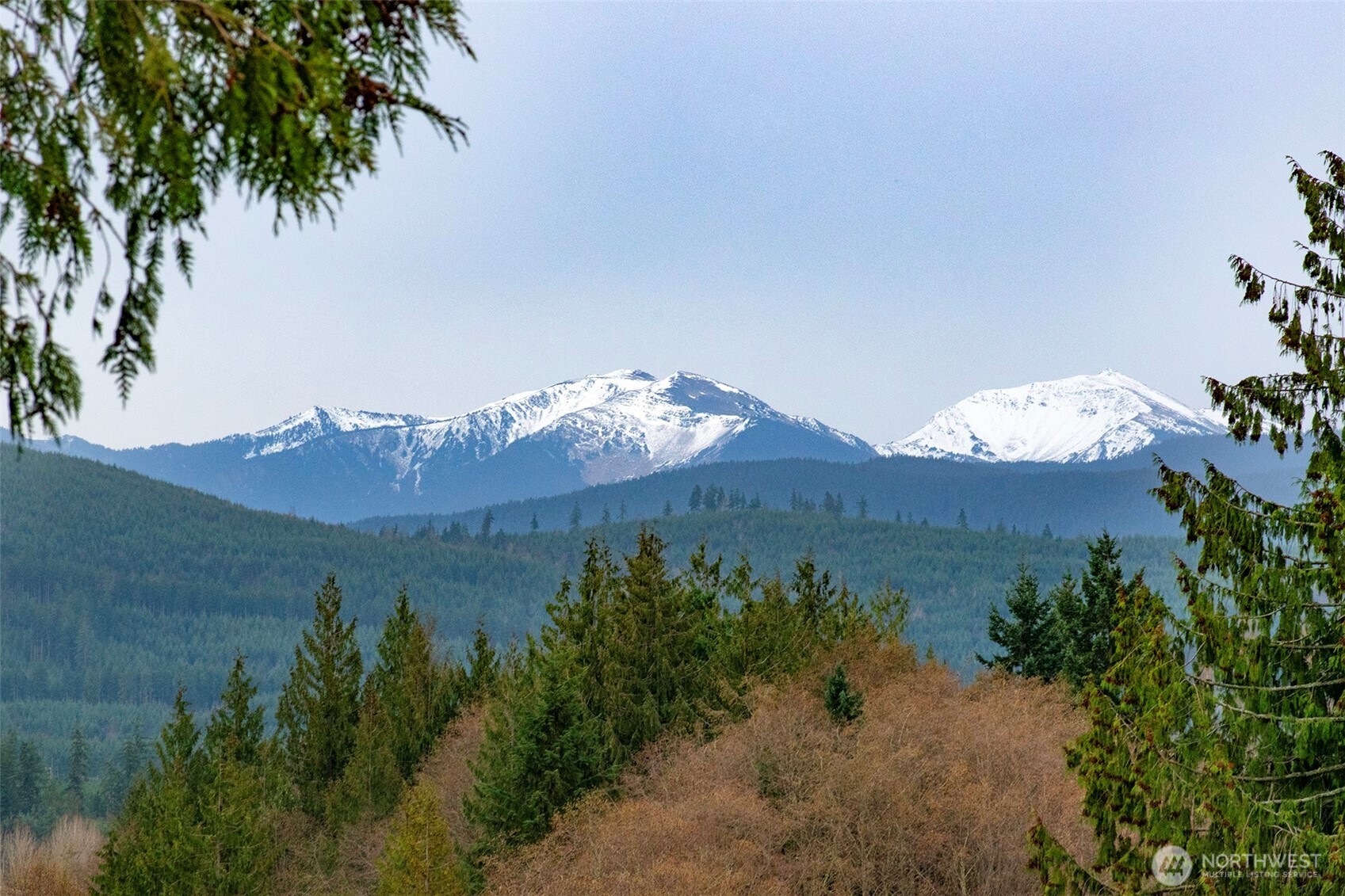 163 Cliff Robinson Lane Sequim, WA 98382 - Photo 2 of 40 a view of a lake with a mountain in the background