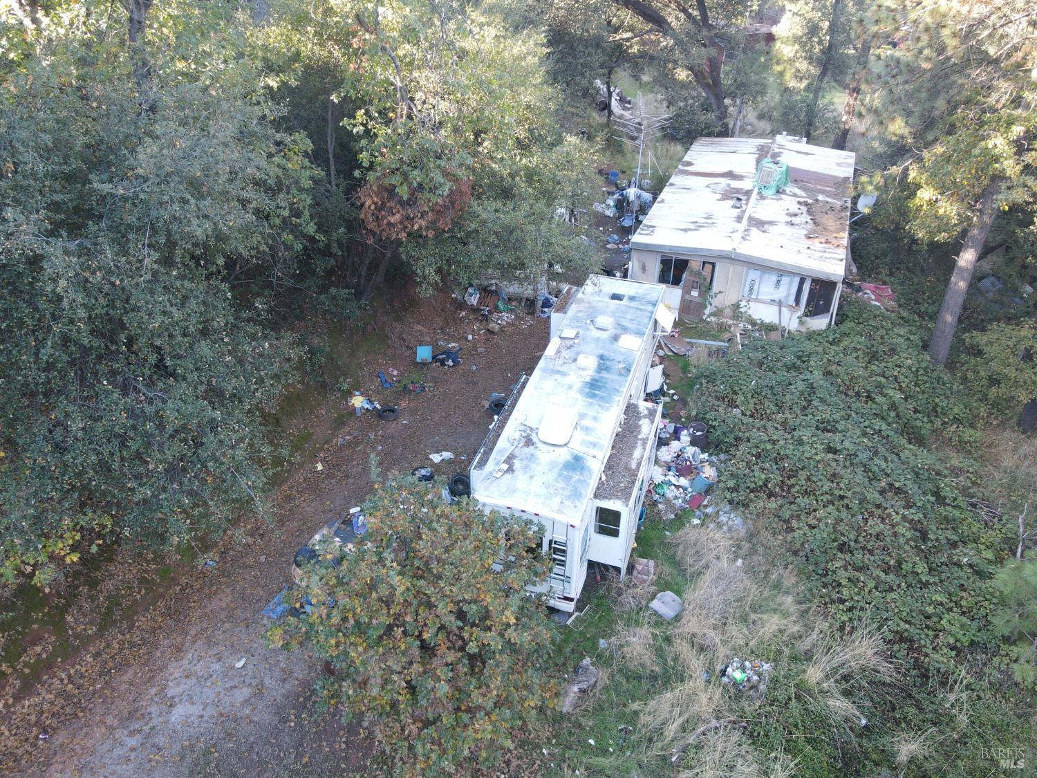 22666 Quail Mine Road Sonora, CA 95370 - Photo 3 of 10 a aerial view of a house with a yard and trees
