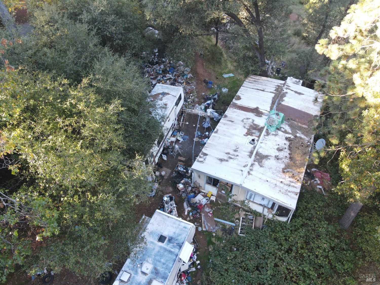 22666 Quail Mine Road Sonora, CA 95370 - Photo 4 of 10 an aerial view of a house with a yard and garden