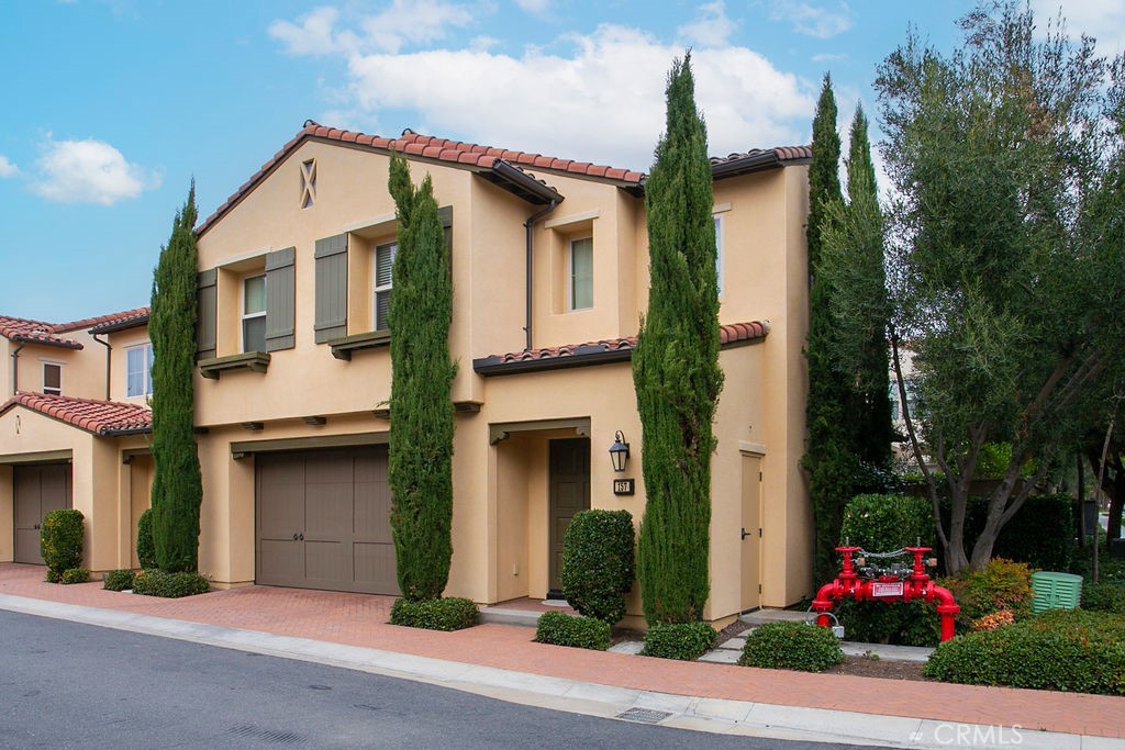 157 Overbrook Irvine, CA 92620 - Photo 1 of 1 a front view of a house with garden