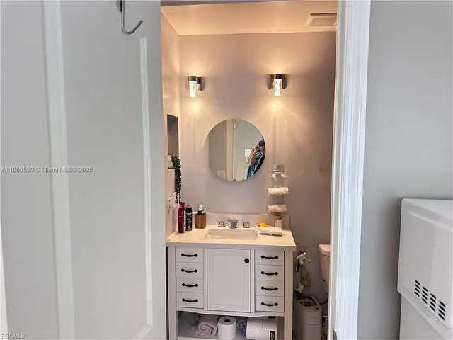 a bathroom with a vanity and a mirror