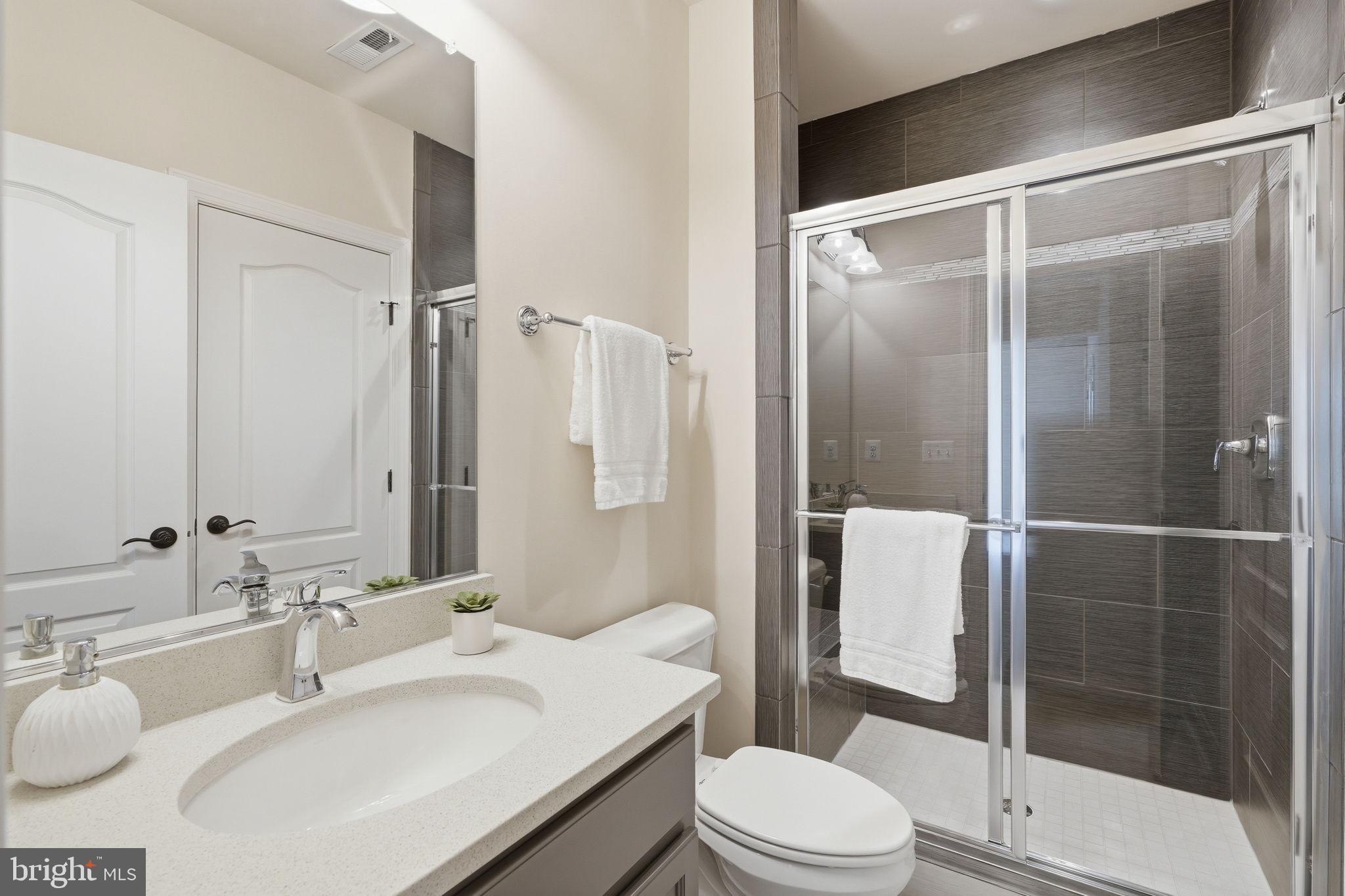 7821 Old Falls Road McLean, VA 22102 - Photo 47 of 62 a bathroom with a sink toilet and shower
