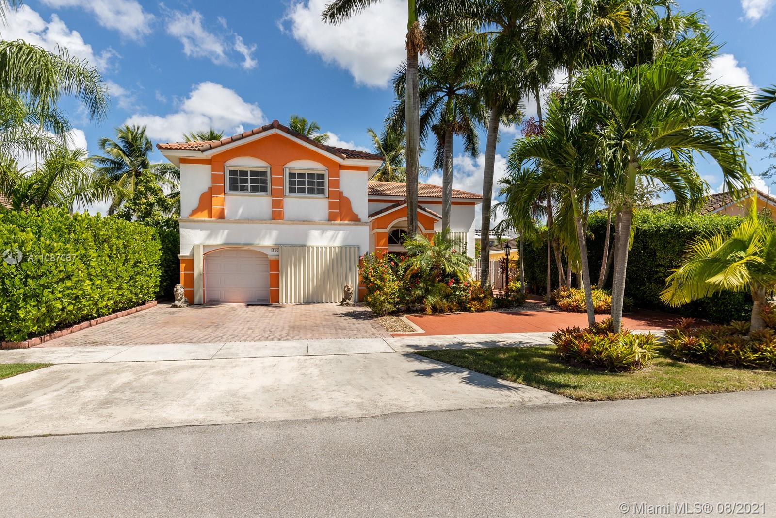 18017 Southwest 148th Ave Road Miami, FL 33187 - Photo 2 of 27 a front view of house with yard