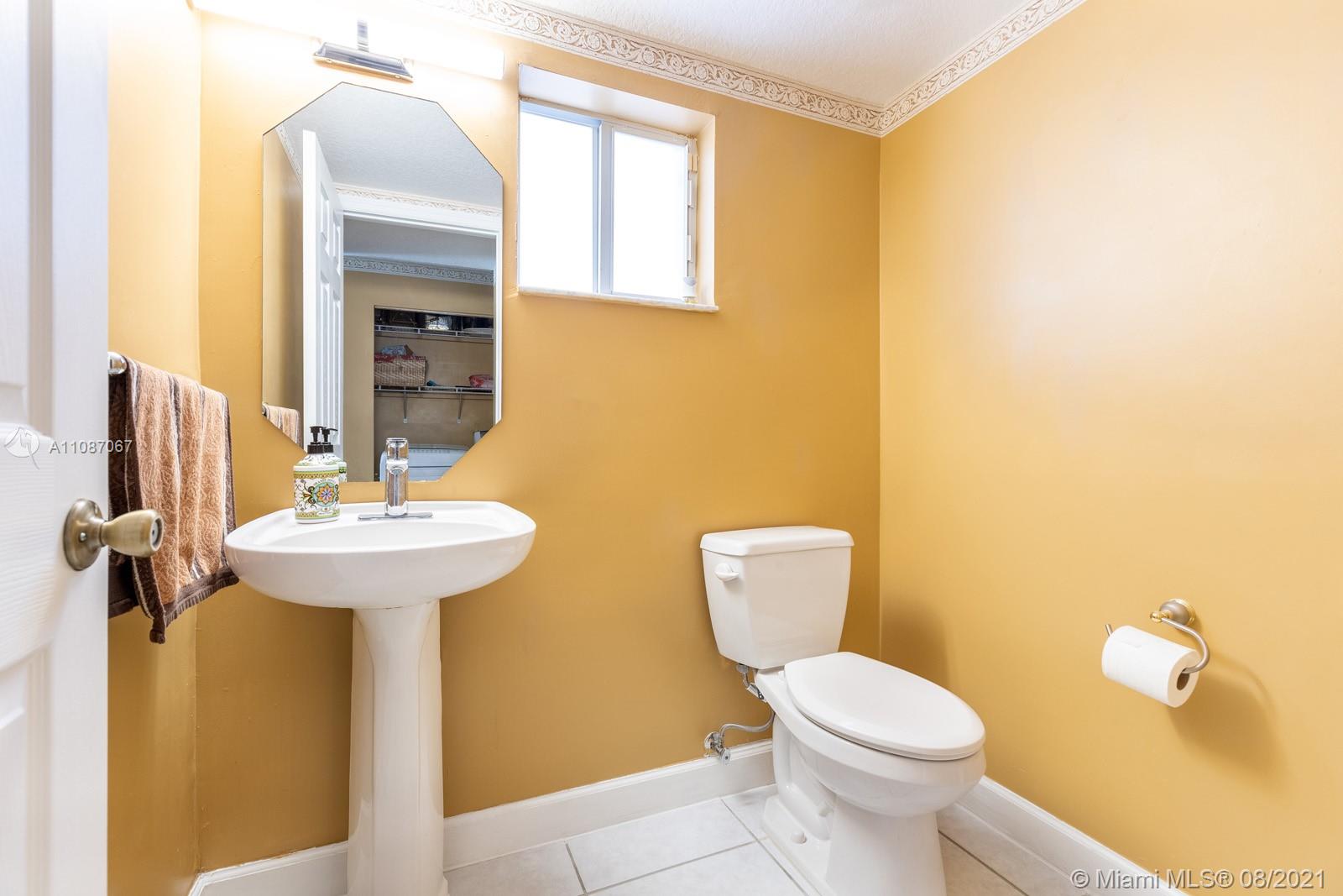 18017 Southwest 148th Ave Road Miami, FL 33187 - Photo 11 of 27 a bathroom with a sink and a toilet