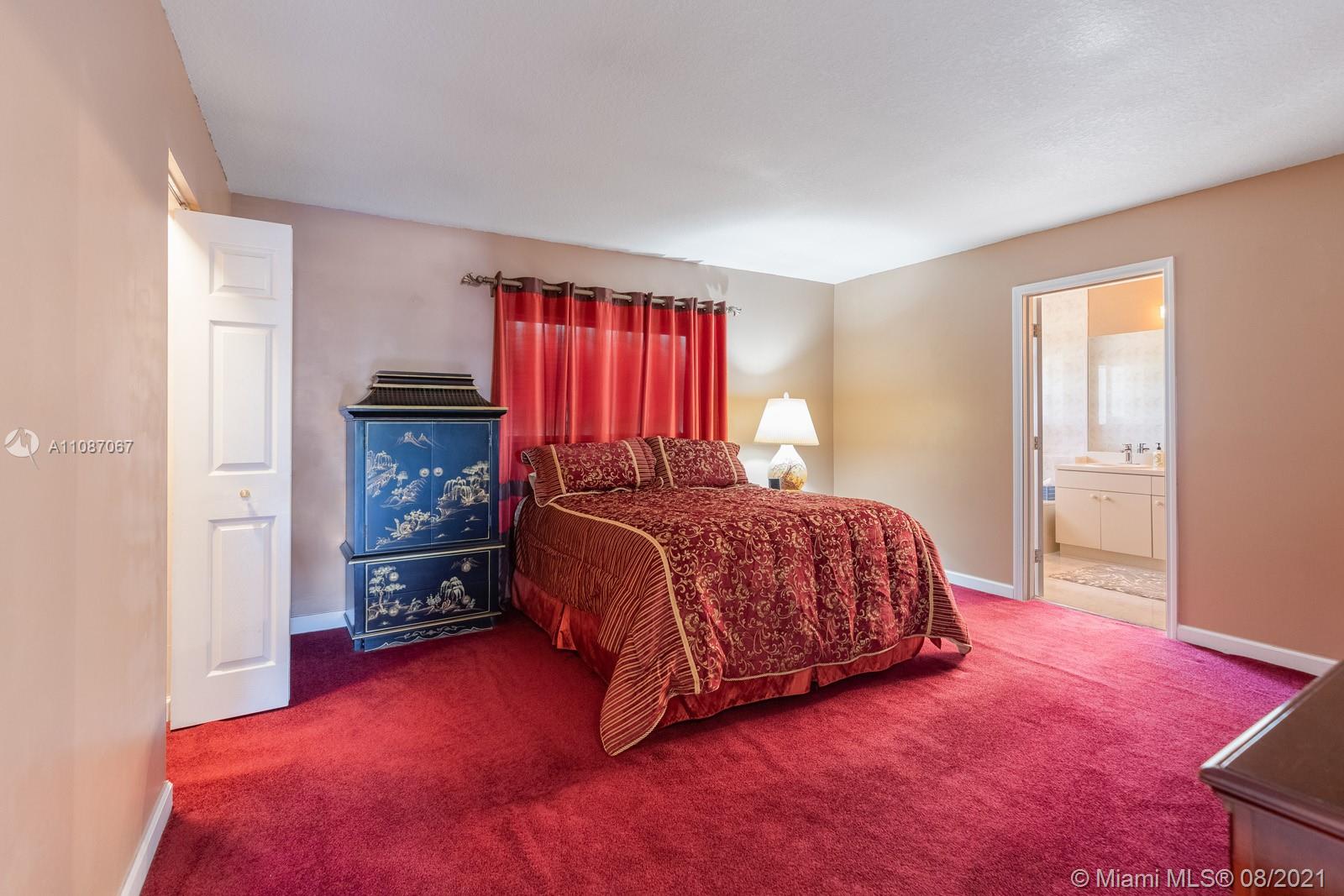 18017 Southwest 148th Ave Road Miami, FL 33187 - Photo 13 of 27 a bedroom with a bed and a window