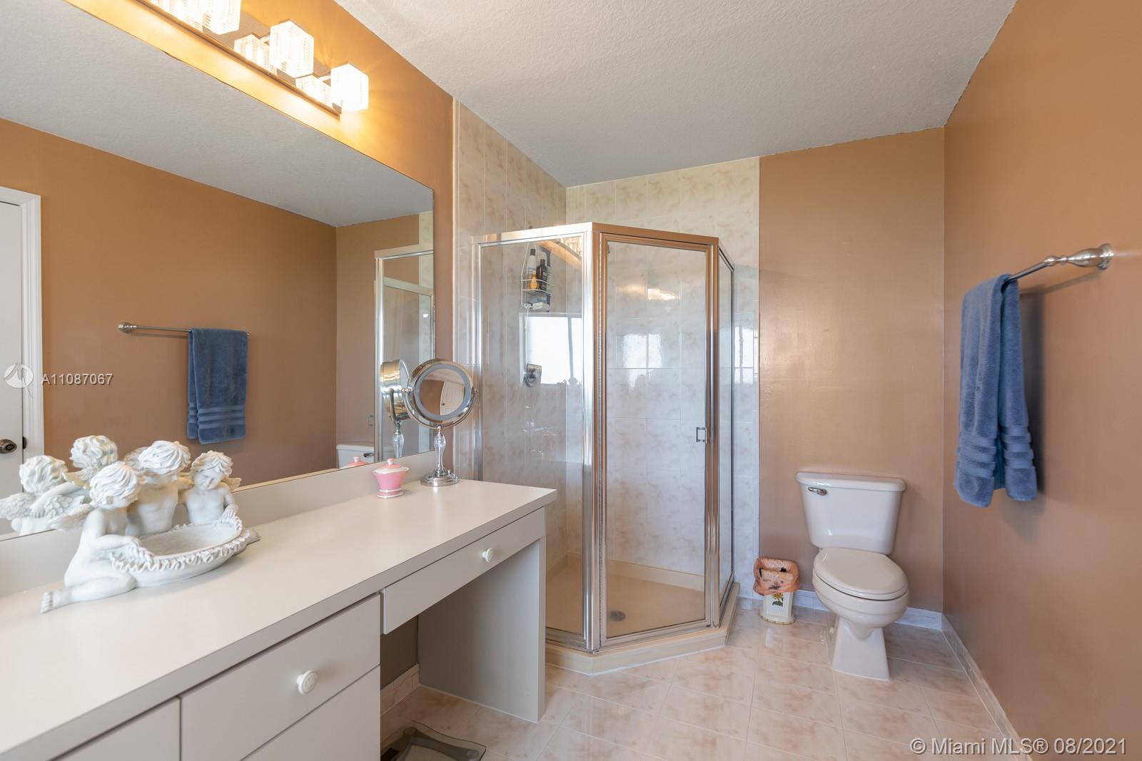 18017 Southwest 148th Ave Road Miami, FL 33187 - Photo 15 of 27 a bathroom with a toilet sink and shower