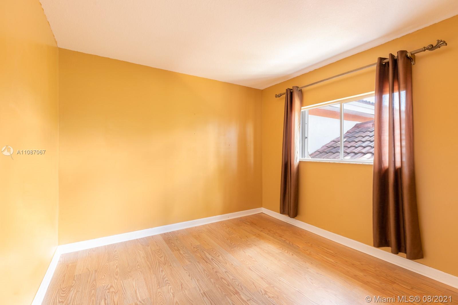 18017 Southwest 148th Ave Road Miami, FL 33187 - Photo 16 of 27 a view of an empty room and window